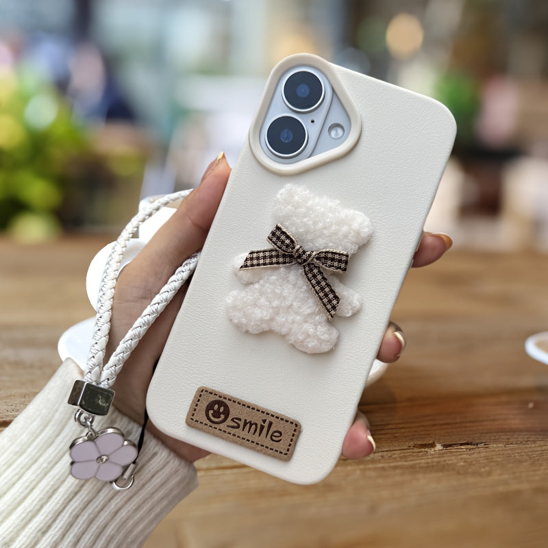 A Single-Pack Plush Teddy Bear Phone Case with a Bow, Available in White And Brown. It Comes with a Wrist Strap And Features a Simple And Elegant Faux Leather Texture That Is Anti-Slip And Fingerprint-Resistant. Made with TPU